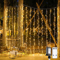 JMEXSUSS 900 LED Outdoor Christmas Curtain Lights, 9.5x29.5ft Christmas Lights Plug in with Remote, Twinkle Hanging String Light for Bedroom Wall Wedding Backdrop Window Gazebo Decor, Warm White